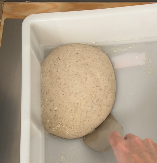 1) with a spatula start to partially remove the dough (best leftover pizza dough ideas)