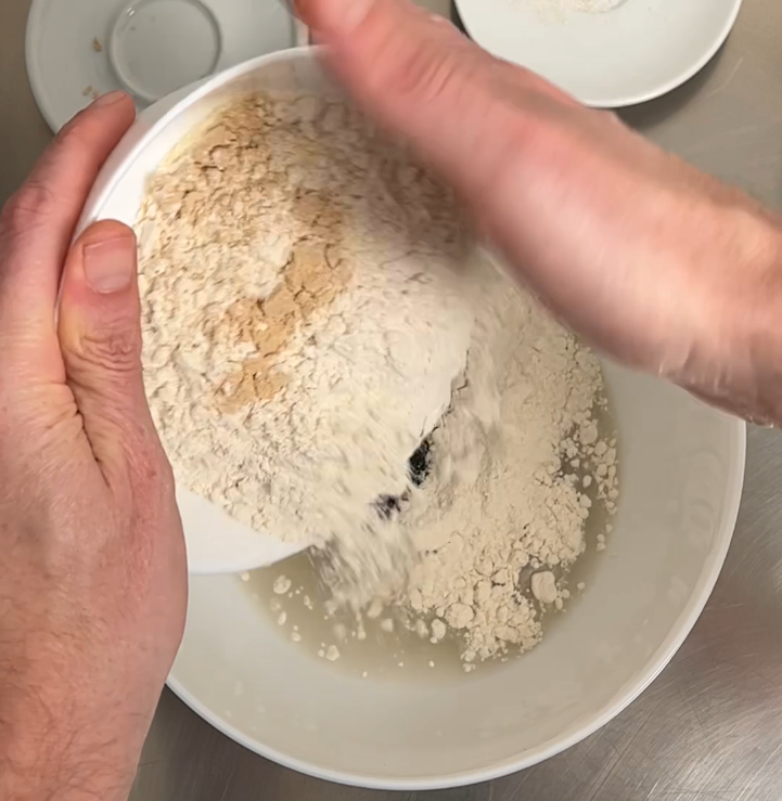 Start adding only part of the flour in water. Start with a 15% of the flour of the recipe.